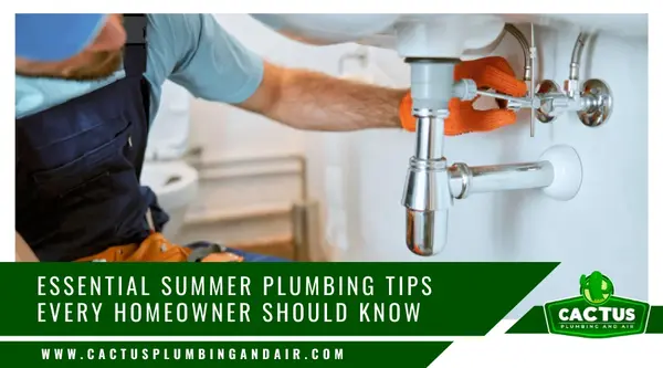 Plumber checking under-sink pipes for leaks